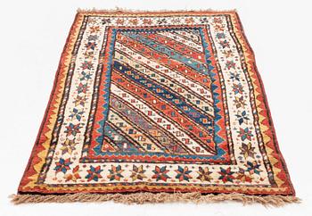 An antique Gendje rug, south Caucasus, c. 208 x 103 cm.
