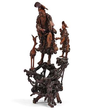 1223. A large well sculptured root sculpture of 'Sholau and attendant', late Qing dynasty, 19th century.