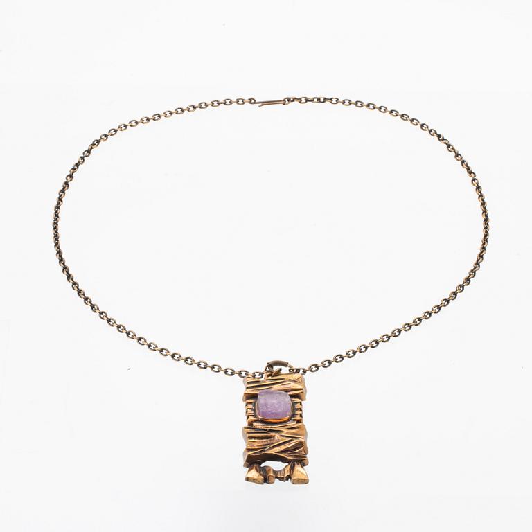 A bronze necklace set with an amethyst by Pentti Sarpaneva.