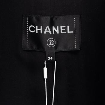 Chanel, a bouclé coat, size 34.