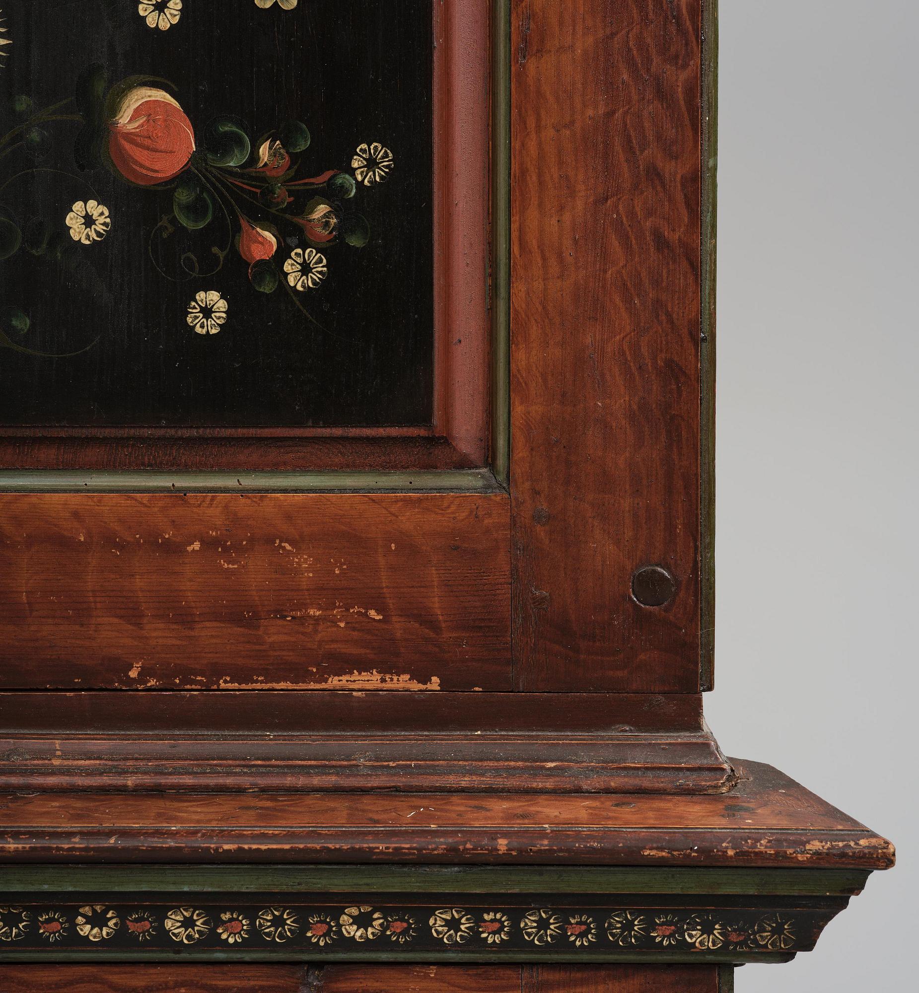 A Swedish polychrome painted folk art corner cabinet, dated 1818.