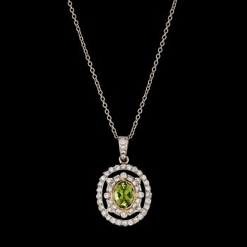 1226. HÄNGSMYCKE, fasettslipad peridot med briljantslipade diamanter, tot. ca 1 ct.