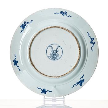 A massive blue and white 'peacock' charger, Qing dynasty, early 18th century.