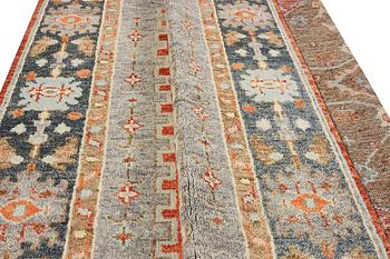 An oriental carpet with Mamluk design, c. 359 x 281 cm.