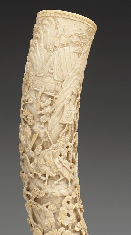 A finely carved ivory tusk, Qing dynasty, 19th Century.