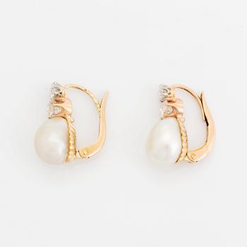 A pair of 18K gold and pearl earrings set with old-cut diamonds.