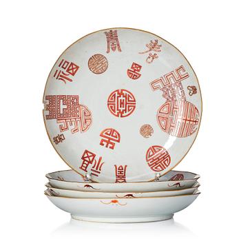 1140. A group of four iron red 'Shou Character' plates, late Qing dynasty.