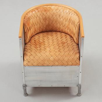 A Mats Theselius aluminium and leather armchair, Värnamo ca 1990.