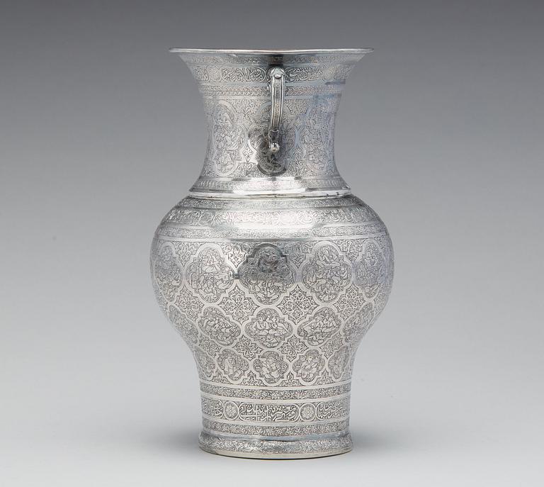 A persian silver two handled vase from the late Qajardynasty.