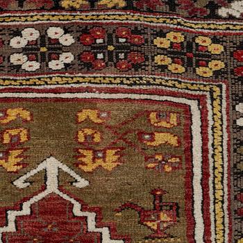 A prayer rug, approx. 140 x 98 cm.