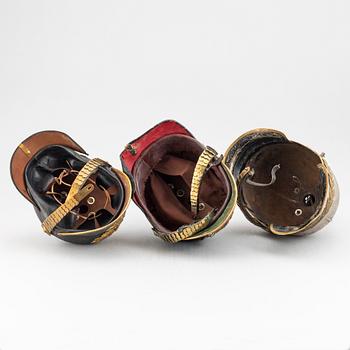 Three Swedish military helmets.