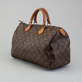 a Louis Vuitton "Speedy 35" bag.