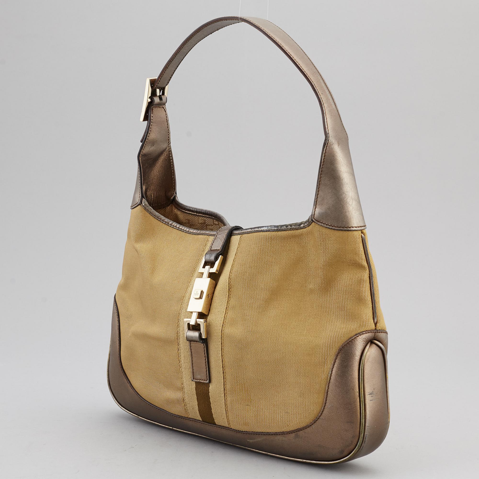 GUCCI, a metallic bag.