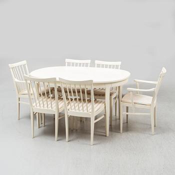 A second half of the 20th Century 'Herrgården' dining table with four chairs and two armchairs by Carl Malmsten.