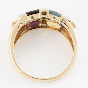 Ring, 18K gold with an oval-cut topaz, garnet, amethyst, peridot, aquamarine, as well as citrine and octagonal-cut diamonds.