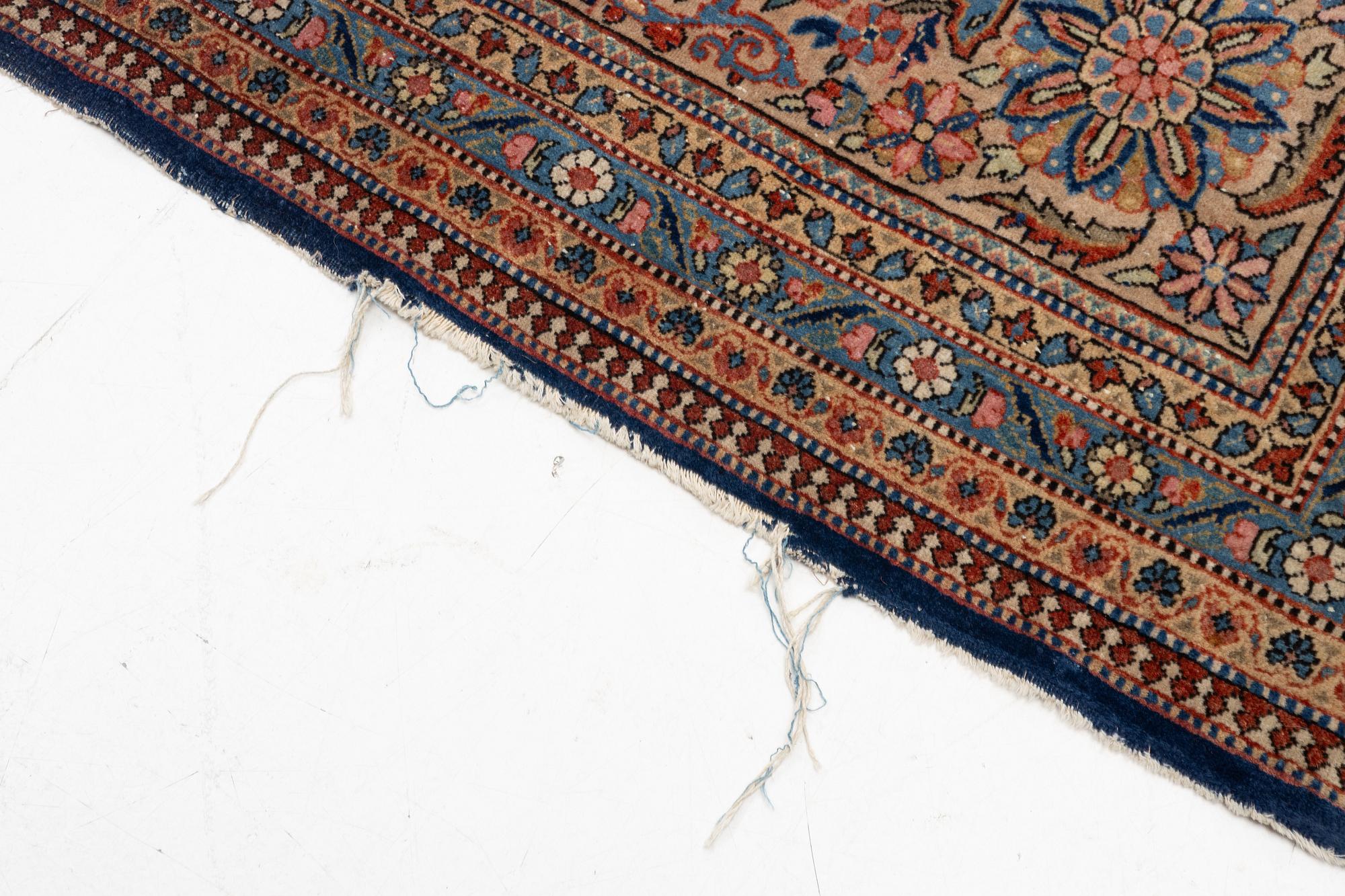 An oriental carpet, c. 425 x 305 cm.