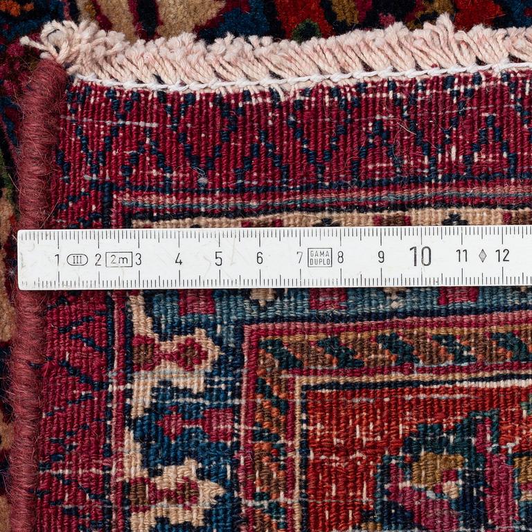 A Mashad carpet, signed Saber, c. 459 x 348 cm.