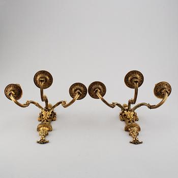 A pair of gilt bronze Louis XVI style wall lights. Late 19th century. 80.
