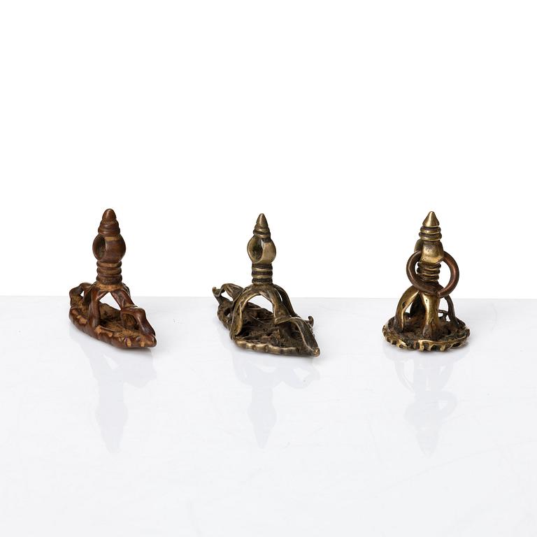 A set of four copper alloy and brass seals, India and China, 18th/19th Century.