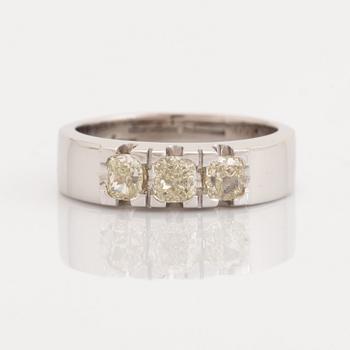 Cushion-cut diamond three stone ring.