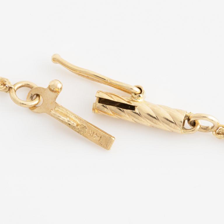 Collier, guld, hänge med smaragder och briljantslipade diamanter.