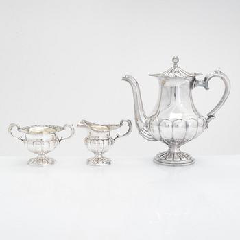 Silver sugar tongs, Herman Wist, Uusikirkko, Carelia 1928, a 3-piece coffee service, a candlestick pair, Finland 1950s.