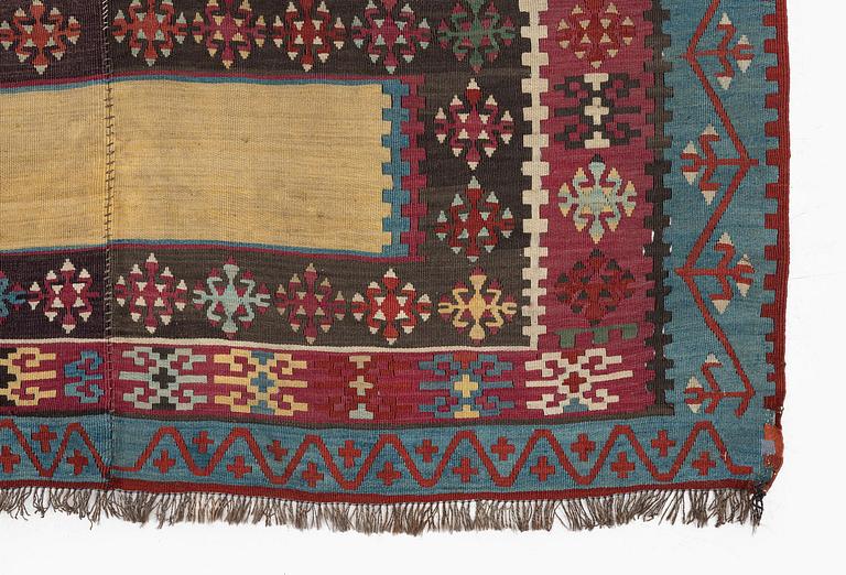 An antique Anatolian kilim, c. 374 x 148 cm.