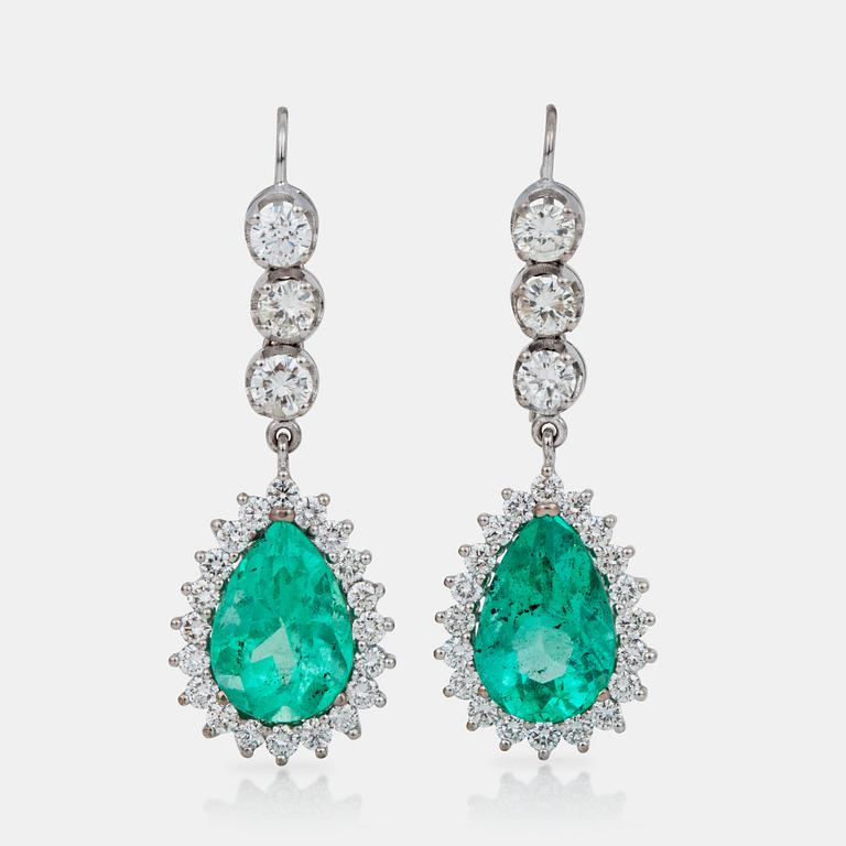 A pair of emerald and brilliant-cut diamond earrings.