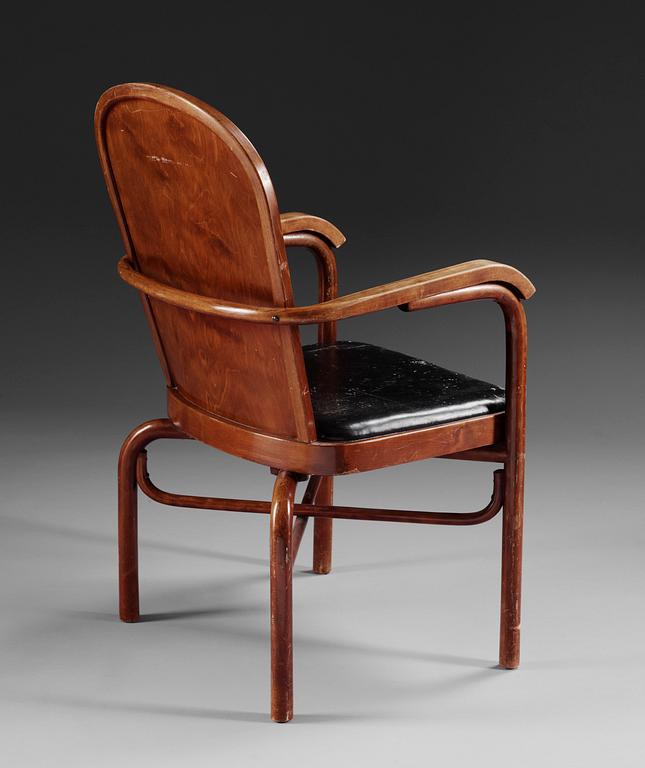A Sigurd Lewerentz stained beech and black leather chair.