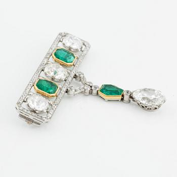 An impressive platinum, step-cut emerald and old-cut diamond brooch by W.A. Bolin likely Moscow 1912-1917. No hallmarks.