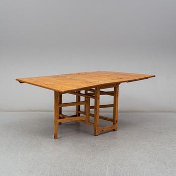 A pine gate-leg table, 19th Century.