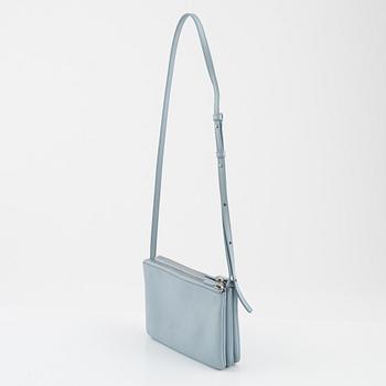 Céline, a baby blue leather 'Trio bag'.