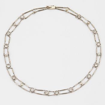 A NECKLACE with round brilliant-cut diamonds and pearls.