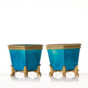 A pair of turkoise bronze mounted flower pots, late Qing dynasty.