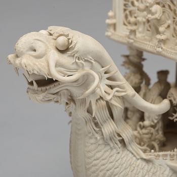 A biscuit porcelain dragon boat of 'Assembly of Immortals', Qing dynasty, Daoguang, signed Chen Guozhi, 19th century.