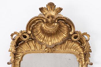 A Rococo mirror, 18th century.