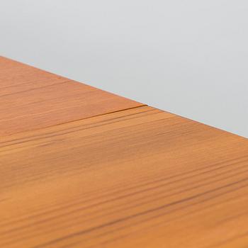 A mid-20th century dining table.