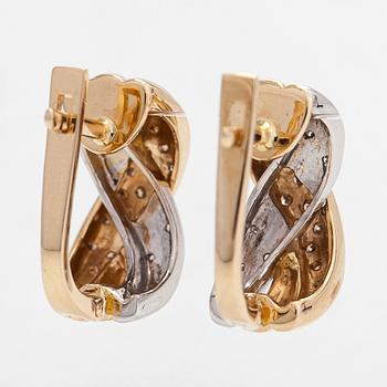 A pair of 14K white/yellow gold earrings, with clear and brown diamonds totaling approximately 0.40 ct.