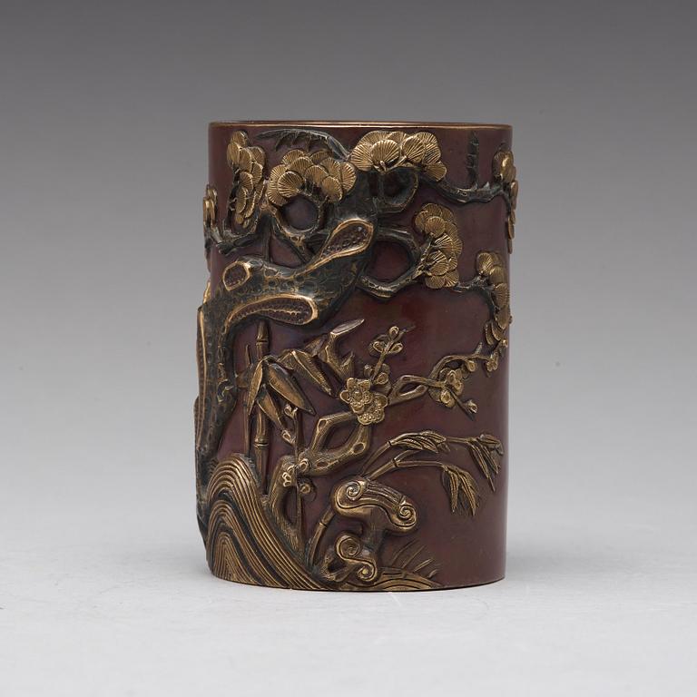 A bronze brush pot, Qing dynasty, with Qianlong seal mark to base.