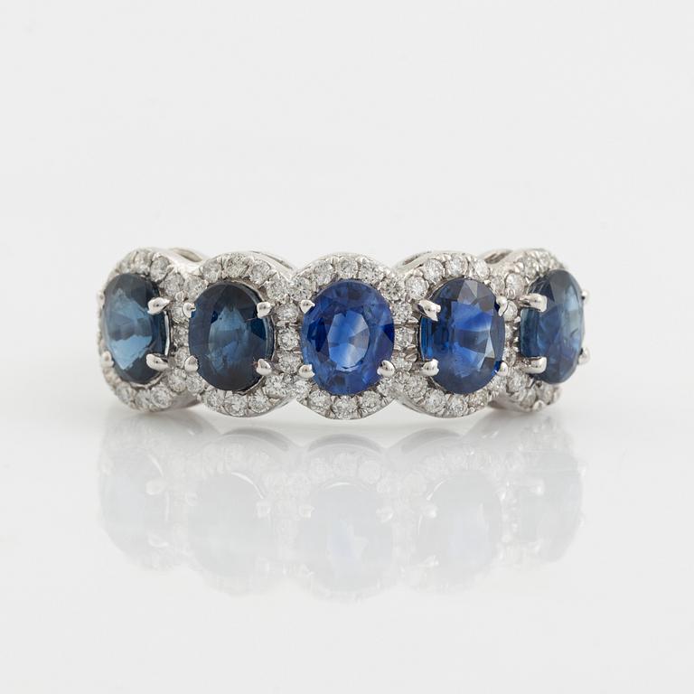 Oval sapphire and brilliant cut diamond ring.