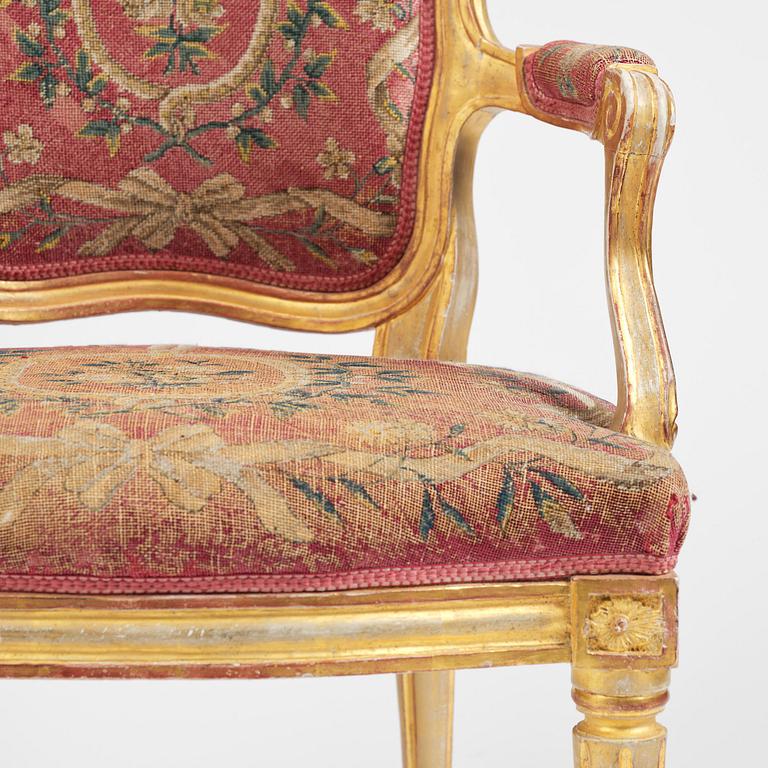 A pair of Gustavian giltwood open armchairs, Stockholm, late 18th century.