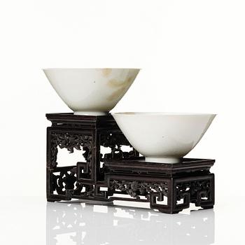 Two Chinese white glazed anhua decorated dragon bowls, Qing dynasty.