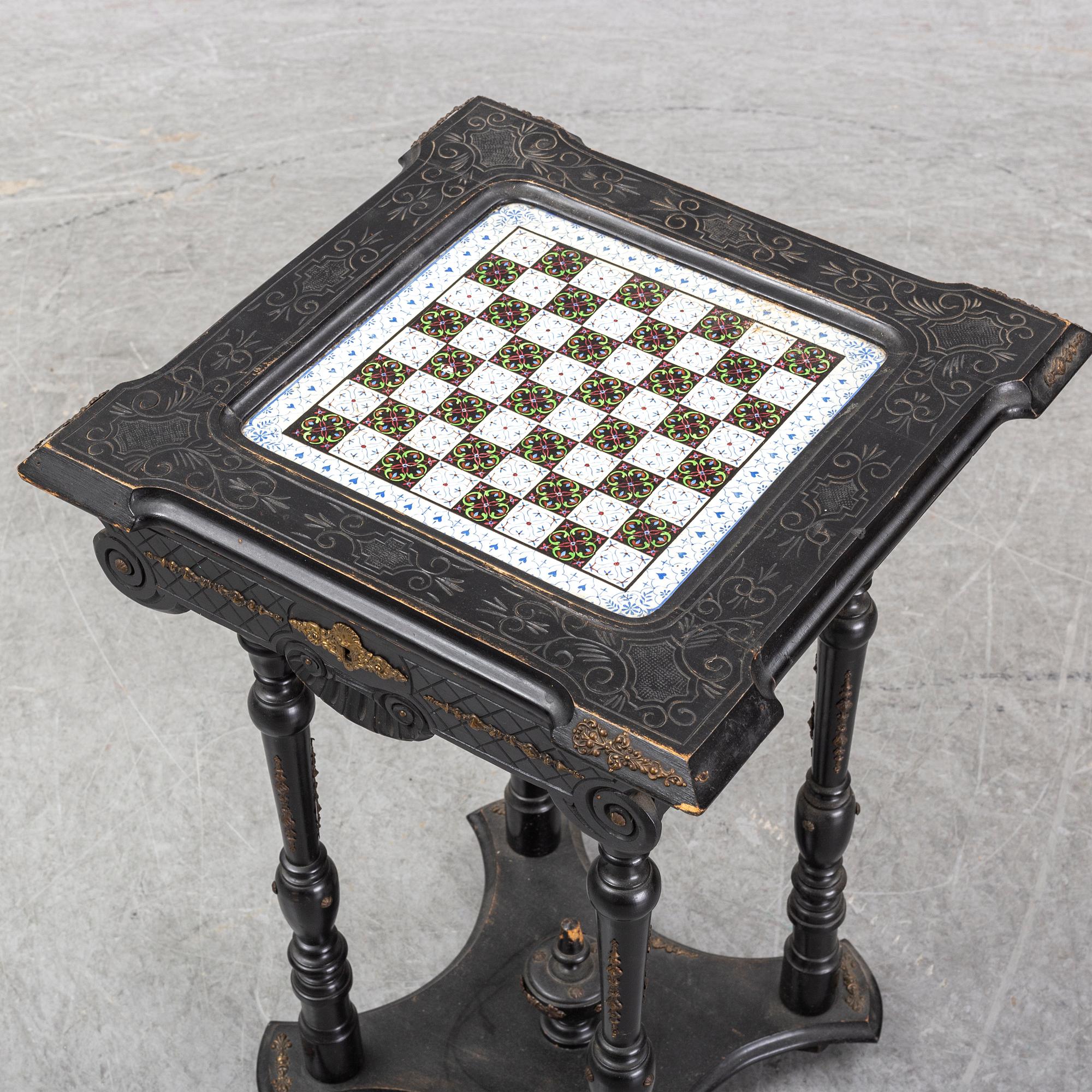 A porcelain and wooden mounted chess table, late 19th century.