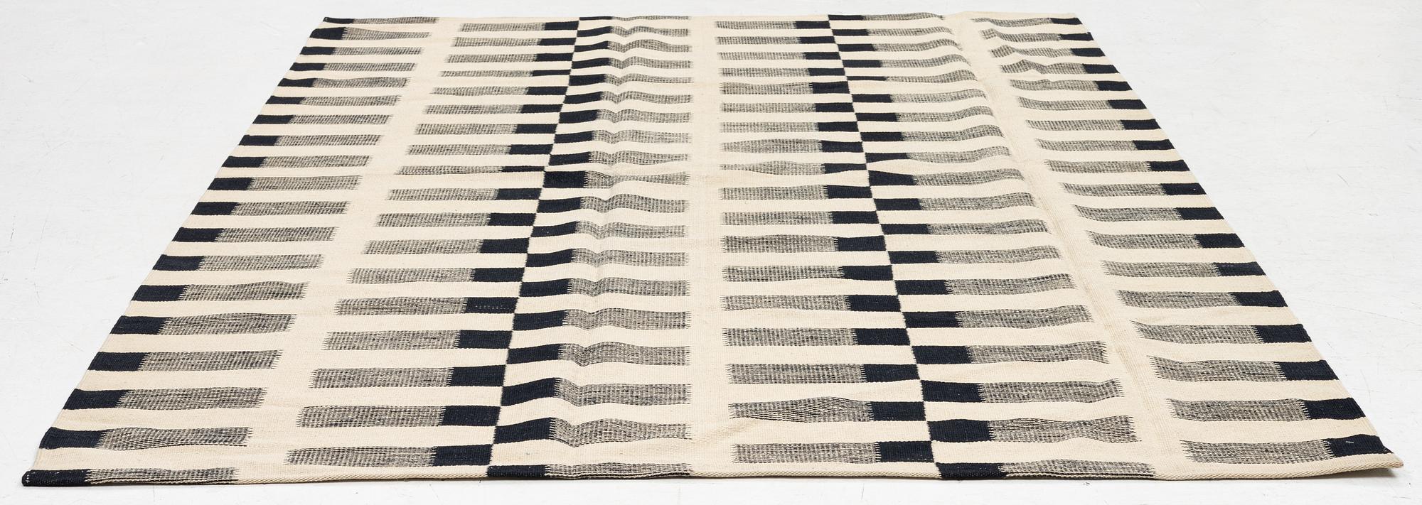 A flat-woven rug, c. 232 x 175 cm.