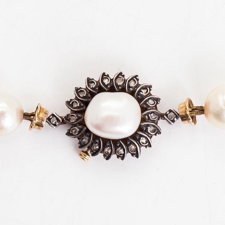 A cultured pearl necklace, with clasp in 18K gold/silver and rose-cut diamonds.