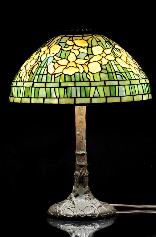 A Tiffany Studios Art Nouveau 'Daffodils' bronze base table lamp, New York circa 1910-15.