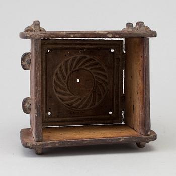 A cheese mould, dated 1768.