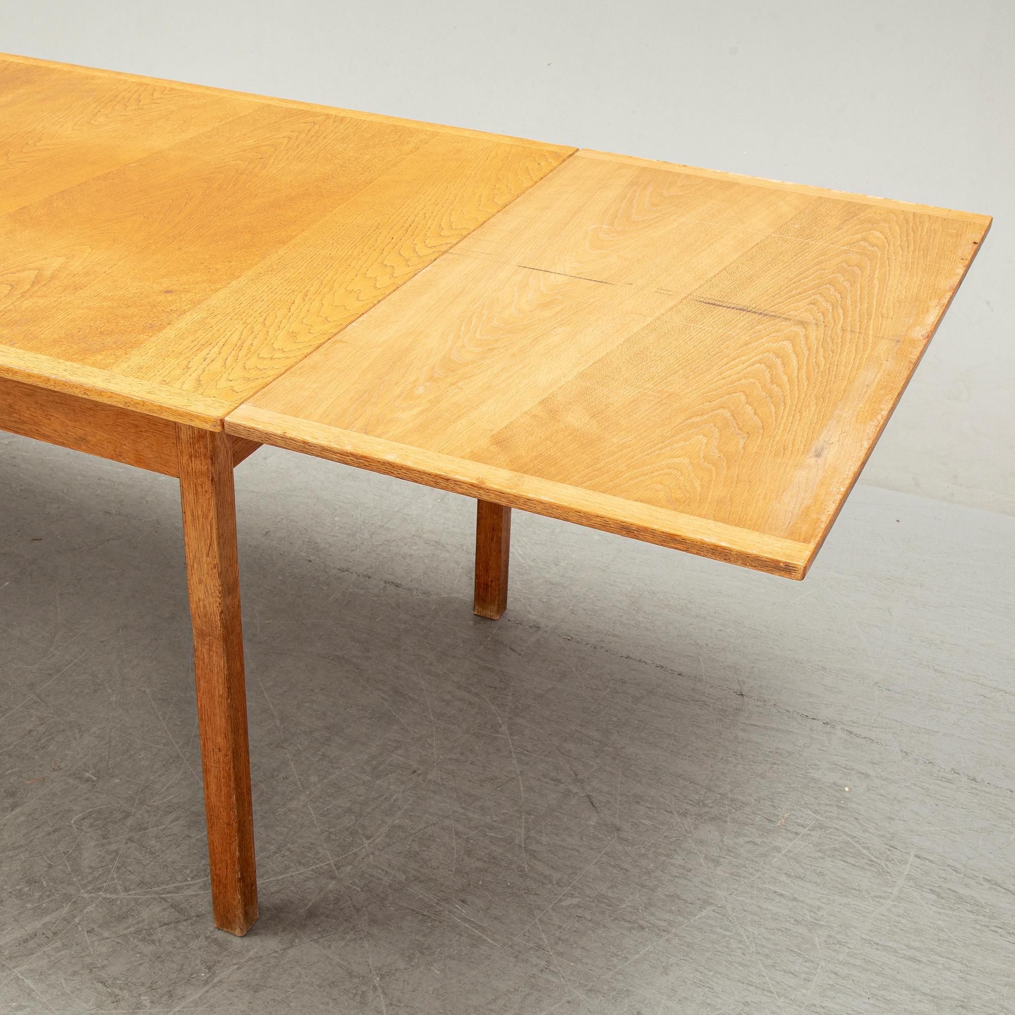 Knud Andersen, a set of six chairs for J.C.A Andersen, Aarhus, Denmark and a dinner table from Troeds, Bjärnum.