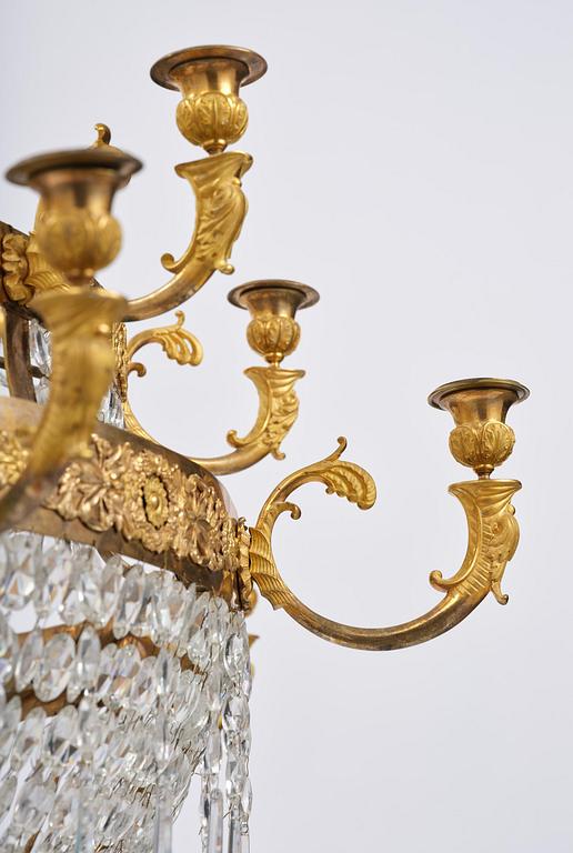 An ormolu and cut glass sixteen-branch Empire chandelier, Paris, early 19th century.