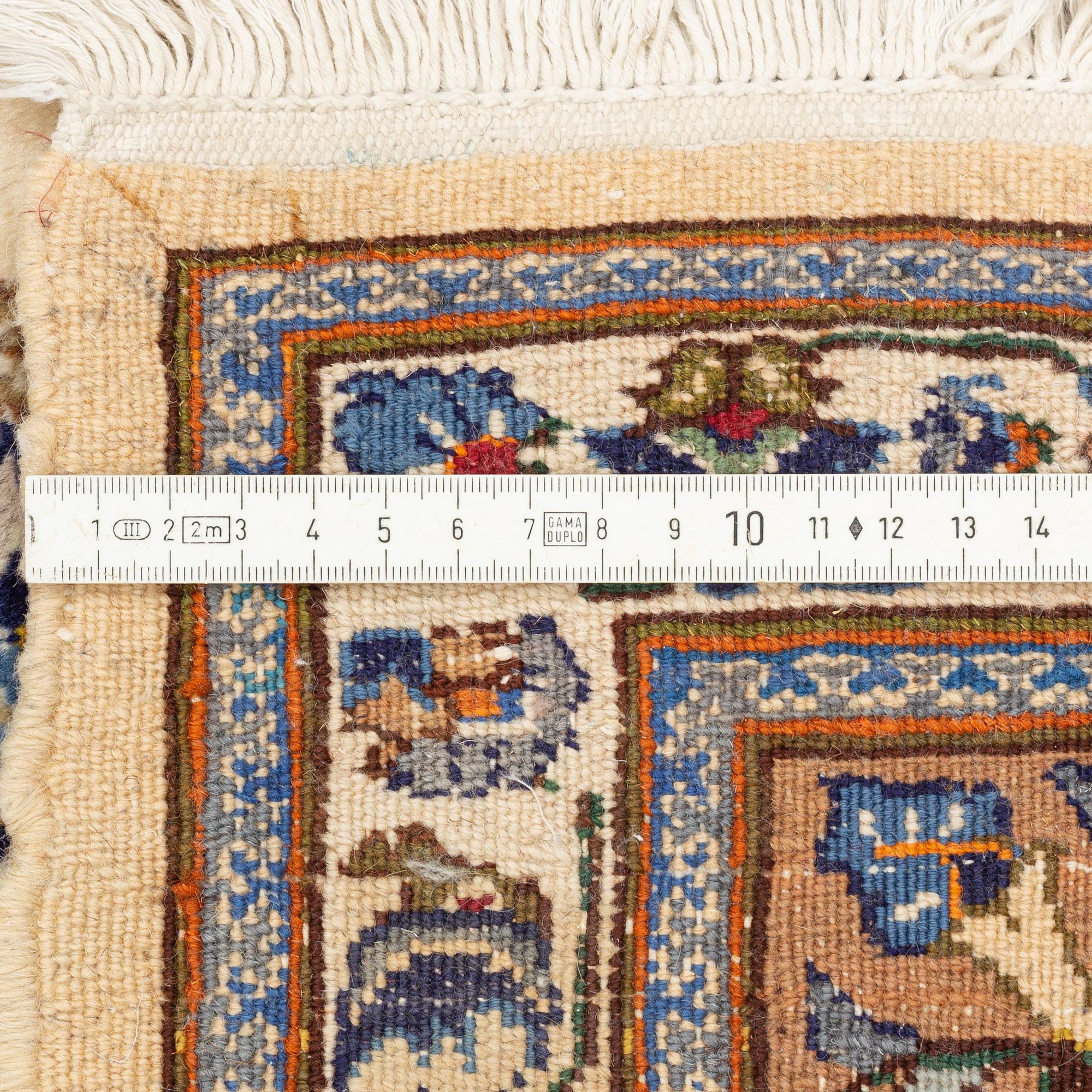 An oriantal carpet, c. 295 x 205 cm.